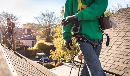 Johnson Restoration Worker Installing New Roof